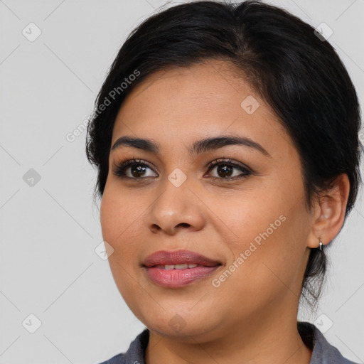 Joyful latino young-adult female with medium  brown hair and brown eyes