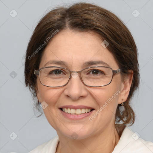 Joyful white adult female with medium  brown hair and brown eyes