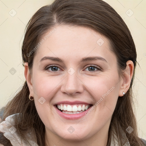 Joyful white young-adult female with long  brown hair and grey eyes