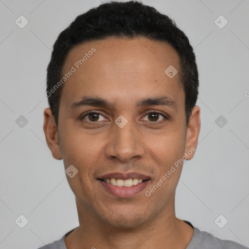 Joyful latino young-adult male with short  black hair and brown eyes