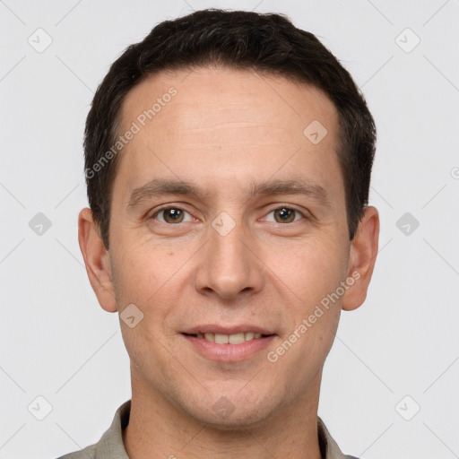 Joyful white adult male with short  brown hair and brown eyes