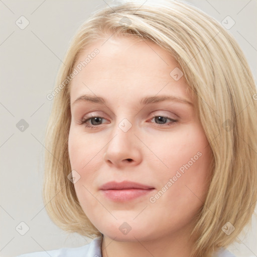 Joyful white young-adult female with medium  brown hair and blue eyes