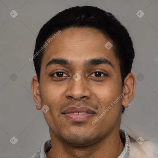 Joyful black young-adult male with short  black hair and brown eyes