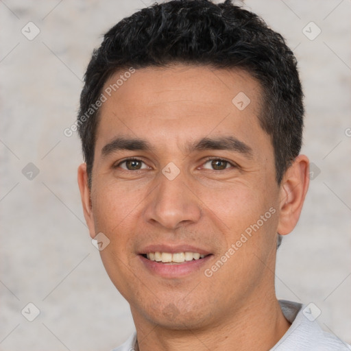 Joyful white young-adult male with short  black hair and brown eyes