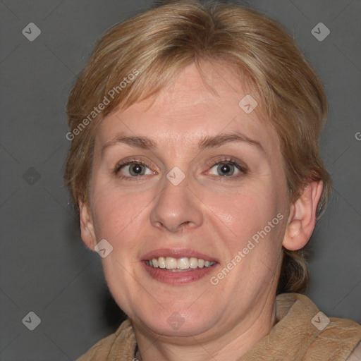 Joyful white adult female with medium  brown hair and blue eyes