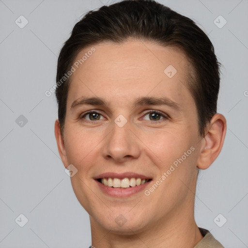 Joyful white young-adult male with short  brown hair and brown eyes