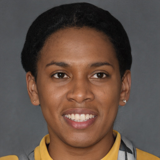 Joyful latino young-adult female with short  brown hair and brown eyes