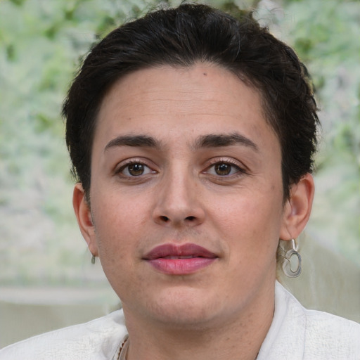 Joyful white young-adult female with short  brown hair and brown eyes