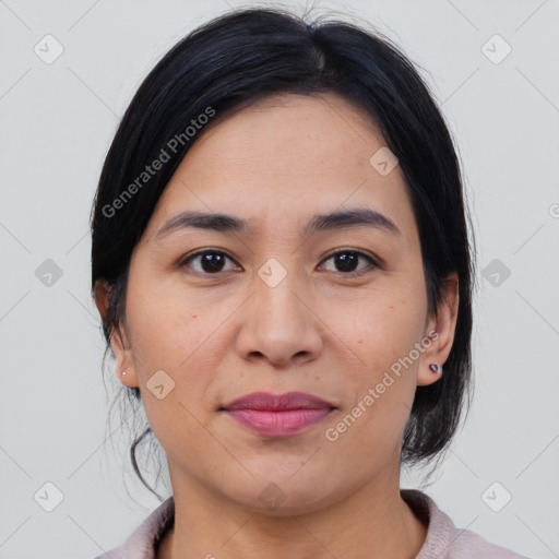 Joyful latino young-adult female with medium  brown hair and brown eyes