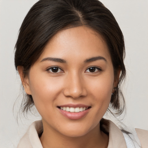 Joyful white young-adult female with medium  brown hair and brown eyes