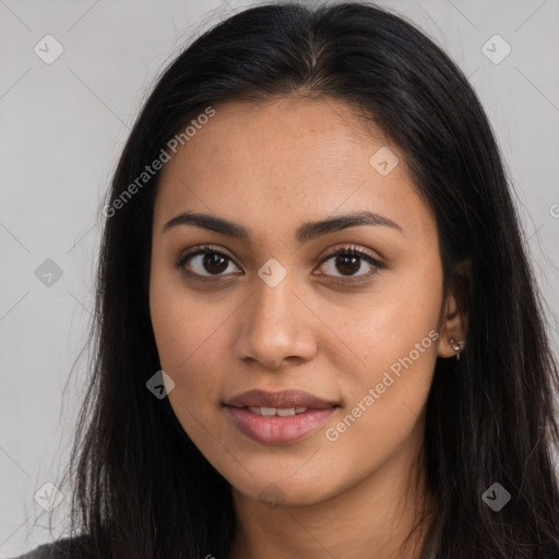 Joyful latino young-adult female with long  brown hair and brown eyes