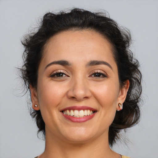 Joyful latino young-adult female with medium  brown hair and brown eyes