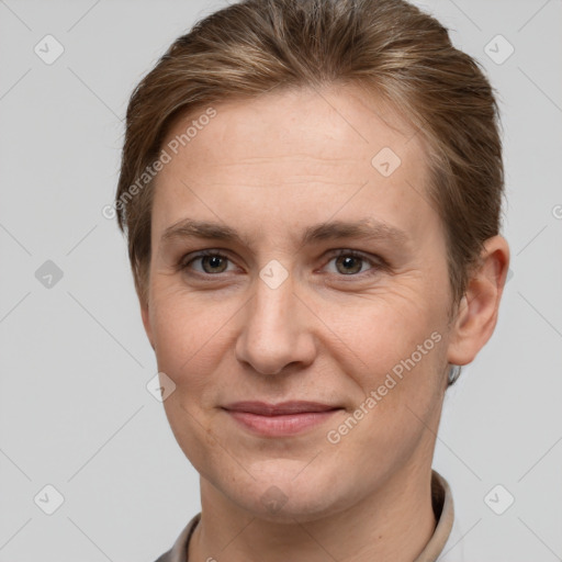 Joyful white adult female with short  brown hair and grey eyes