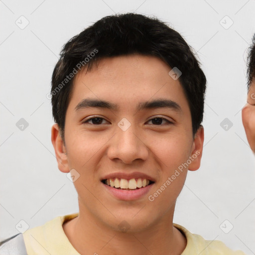 Joyful asian young-adult male with short  black hair and brown eyes