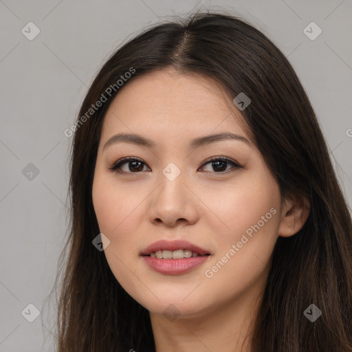 Joyful asian young-adult female with long  brown hair and brown eyes