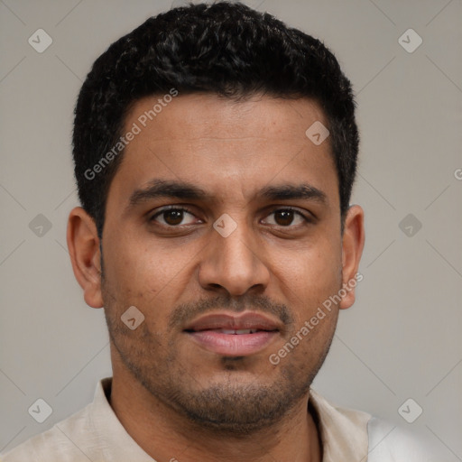 Joyful black young-adult male with short  brown hair and brown eyes