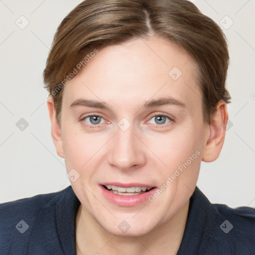 Joyful white young-adult female with short  brown hair and grey eyes