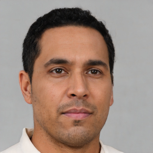 Neutral latino young-adult male with short  brown hair and brown eyes