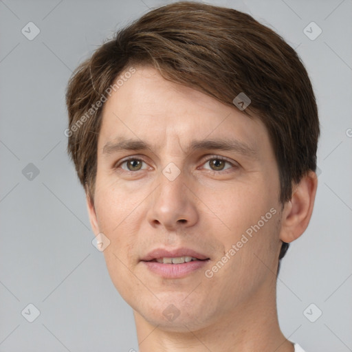 Joyful white adult male with short  brown hair and grey eyes