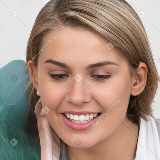 Joyful white young-adult female with long  brown hair and blue eyes