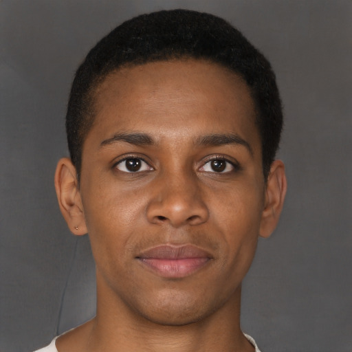 Joyful black young-adult male with short  brown hair and brown eyes