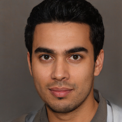 Neutral latino young-adult male with short  black hair and brown eyes