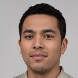 Neutral latino young-adult male with short  black hair and brown eyes
