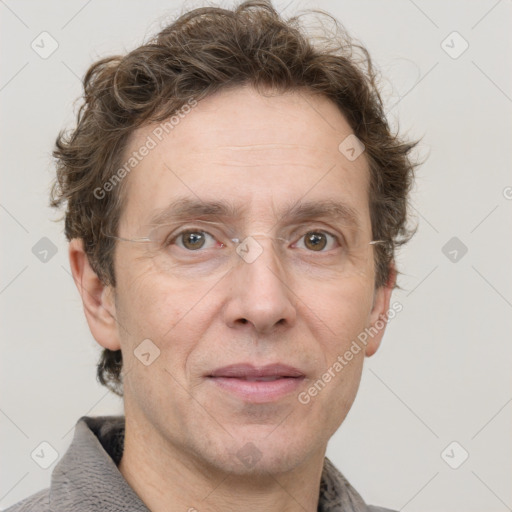 Joyful white adult male with short  brown hair and grey eyes