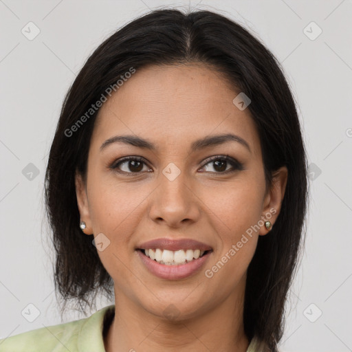 Joyful latino young-adult female with long  brown hair and brown eyes