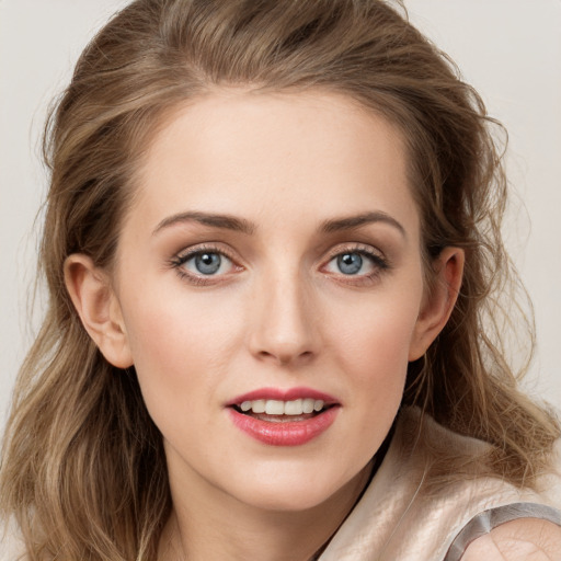 Joyful white young-adult female with long  brown hair and grey eyes