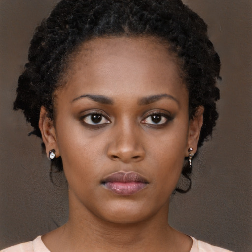 Neutral black young-adult female with long  brown hair and brown eyes