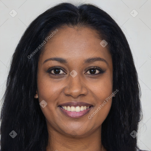 Joyful black young-adult female with long  brown hair and brown eyes