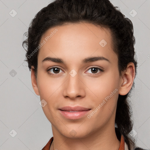 Joyful latino young-adult female with short  brown hair and brown eyes