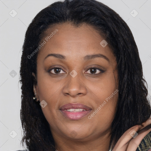 Joyful latino adult female with long  brown hair and brown eyes