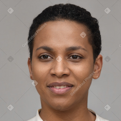 Joyful black young-adult female with short  black hair and brown eyes