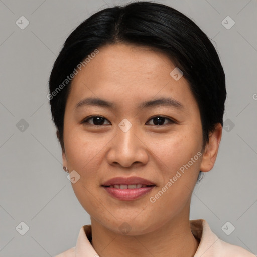 Joyful asian young-adult female with short  brown hair and brown eyes