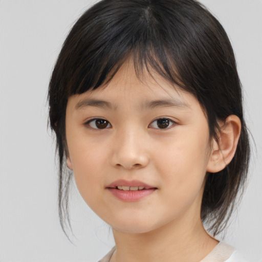 Joyful asian child female with medium  brown hair and brown eyes