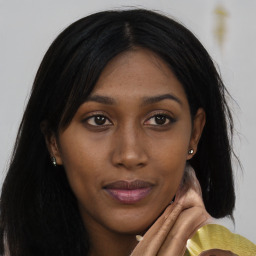 Joyful asian young-adult female with long  brown hair and brown eyes