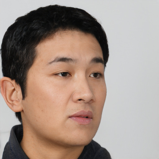 Neutral asian young-adult male with short  black hair and brown eyes