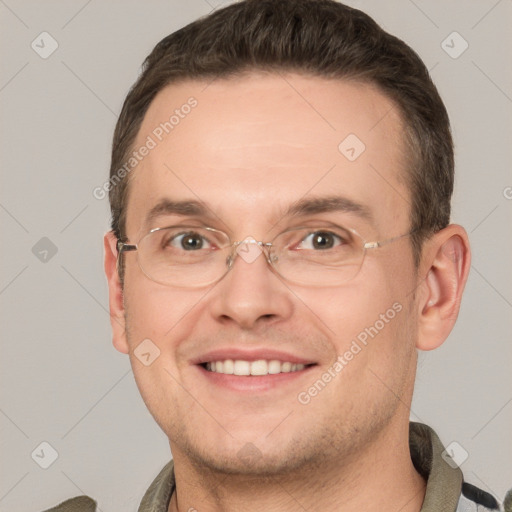 Joyful white adult male with short  brown hair and grey eyes