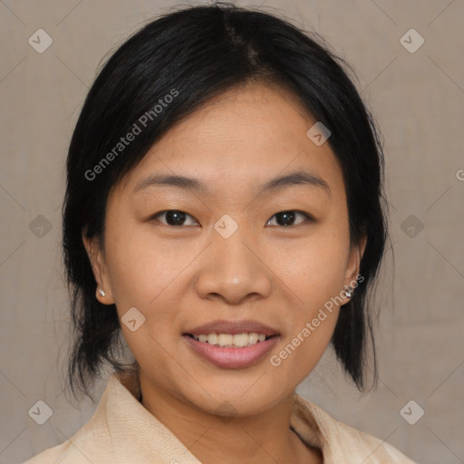 Joyful asian young-adult female with medium  black hair and brown eyes