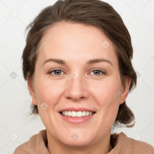 Joyful white adult female with medium  brown hair and grey eyes