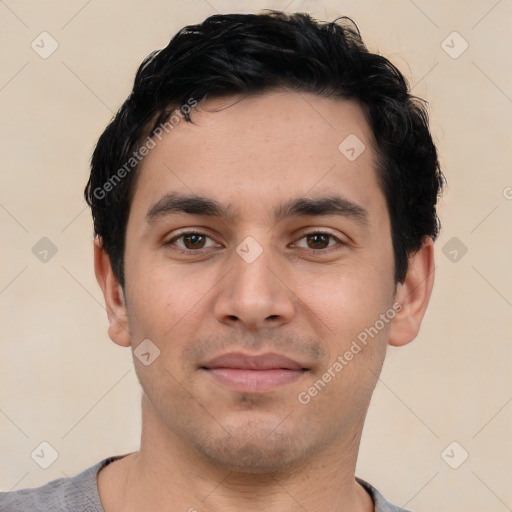 Joyful white young-adult male with short  black hair and brown eyes