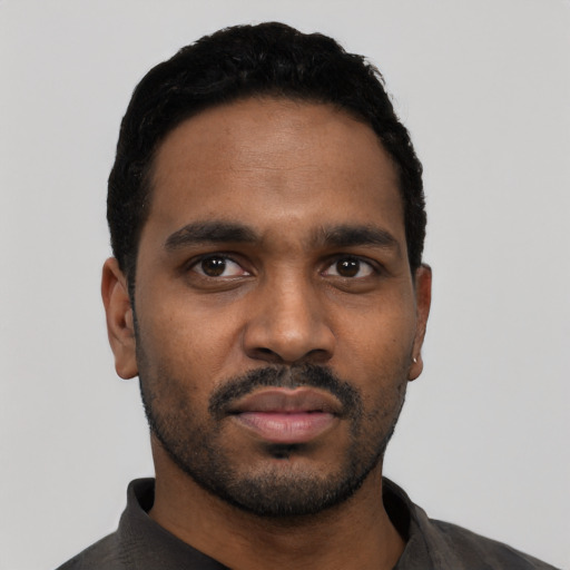 Neutral black young-adult male with short  black hair and brown eyes