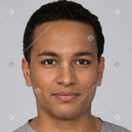 Joyful black young-adult male with short  brown hair and brown eyes