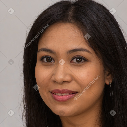 Joyful latino young-adult female with long  brown hair and brown eyes