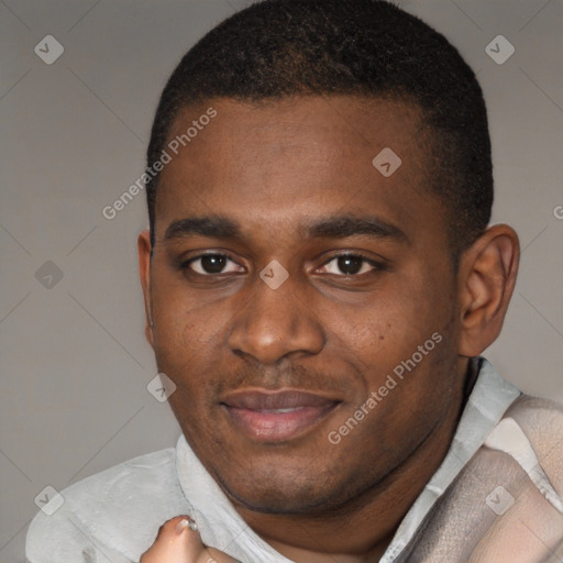 Joyful black young-adult male with short  brown hair and brown eyes