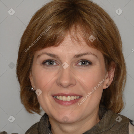 Joyful white adult female with medium  brown hair and brown eyes