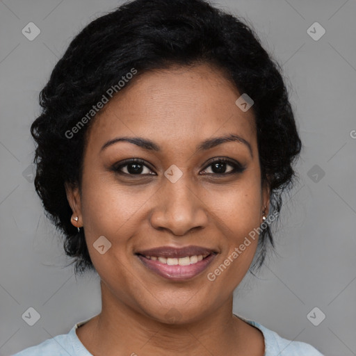 Joyful black adult female with medium  brown hair and brown eyes