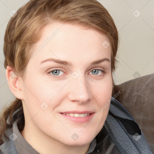 Joyful white young-adult female with medium  brown hair and blue eyes